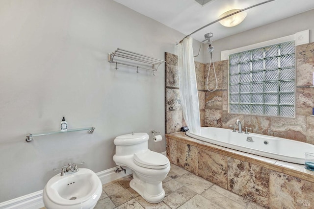 bathroom featuring shower / tub combo with curtain, a bidet, and toilet