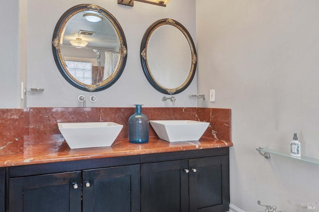 bathroom with vanity and backsplash