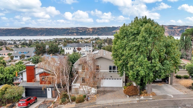 bird's eye view featuring a water and mountain view