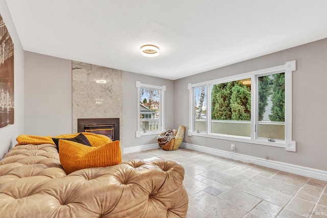 living room with a high end fireplace