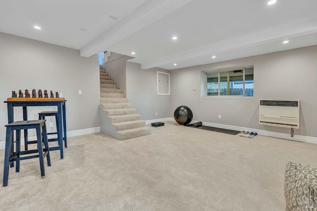 workout area with electric panel, heating unit, and light colored carpet