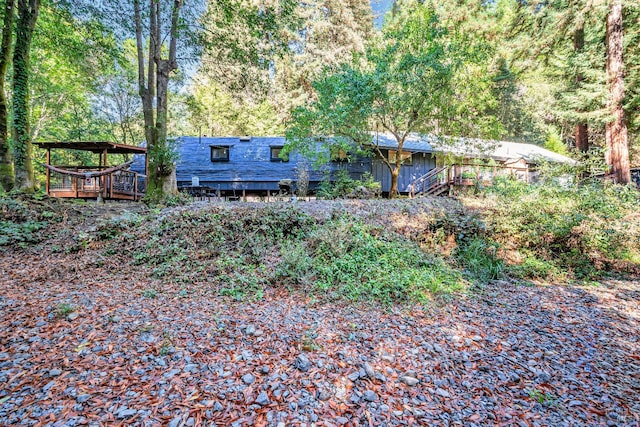 view of yard featuring a wooden deck