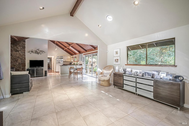 interior space featuring vaulted ceiling with beams