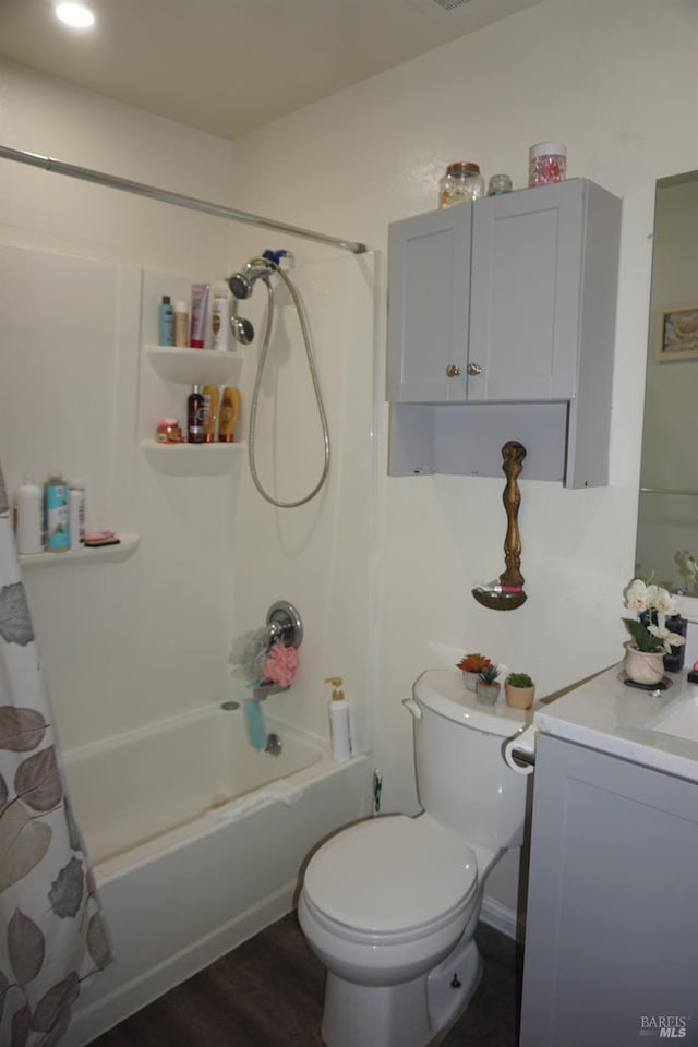 full bathroom featuring toilet, vanity, wood-type flooring, and shower / tub combo