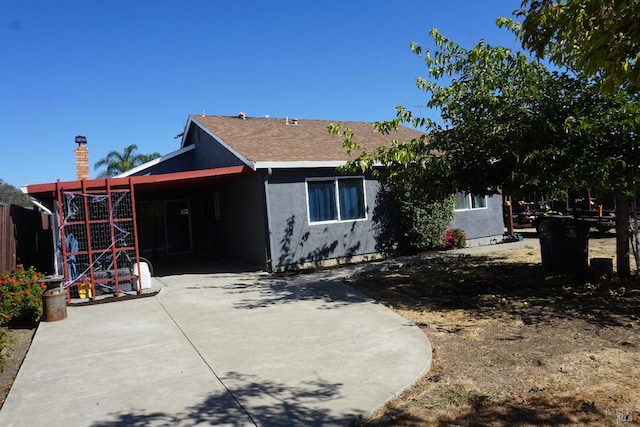 view of front of house with a carport