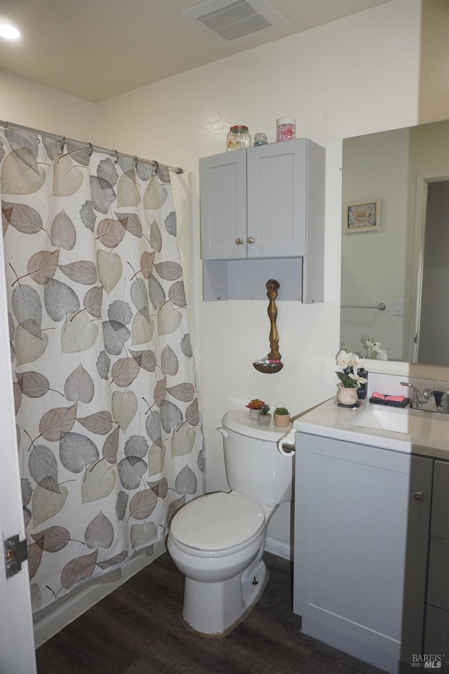 bathroom with vanity, toilet, wood-type flooring, and a shower with curtain