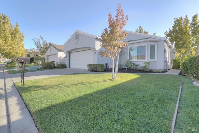 view of front of house with a garage and a front lawn