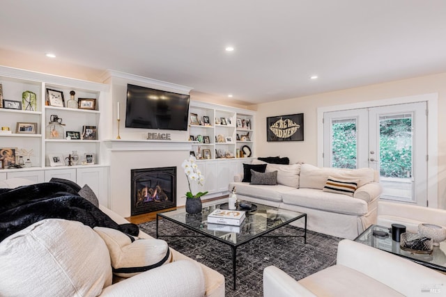 living room with french doors and built in shelves