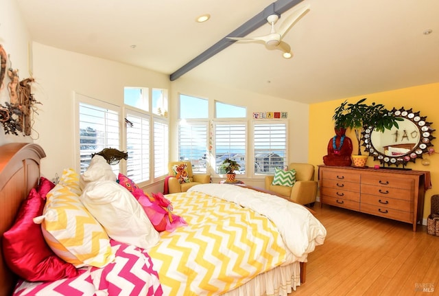 bedroom with light hardwood / wood-style floors, lofted ceiling with beams, and ceiling fan