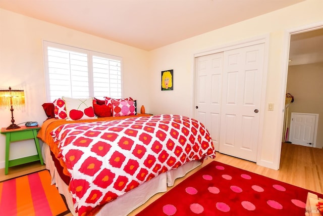 bedroom featuring a closet and wood finished floors