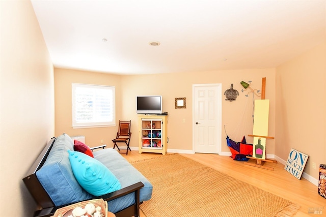 interior space featuring baseboards and wood finished floors