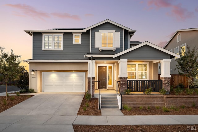 craftsman house featuring a garage and a porch