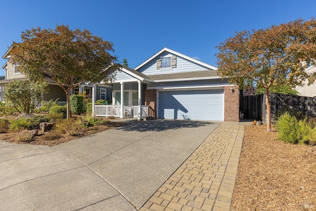 view of front of home with a porch and a garage