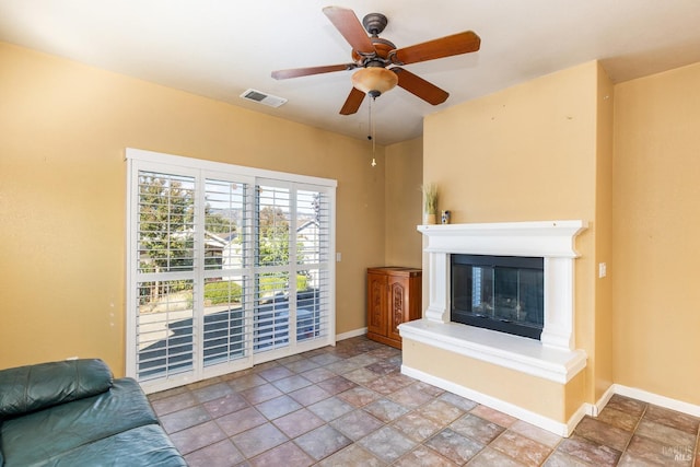 living room featuring ceiling fan