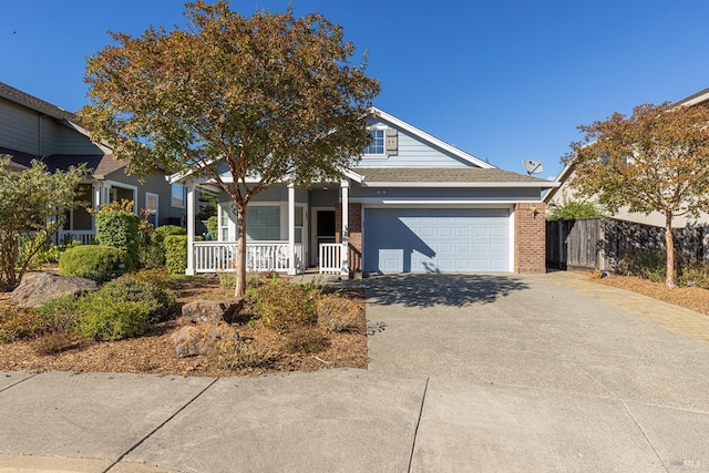 view of front of house with a garage and a porch