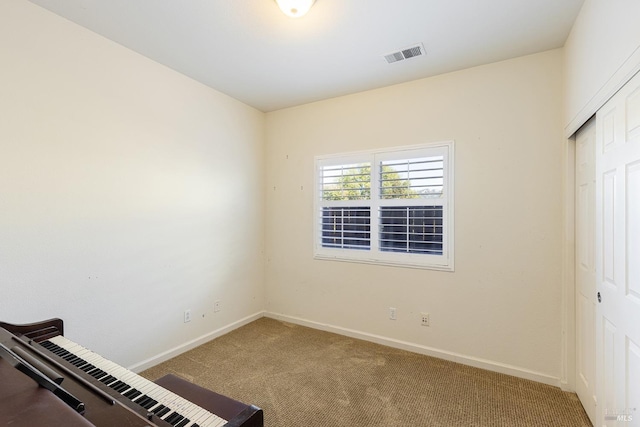 unfurnished bedroom featuring carpet floors and a closet