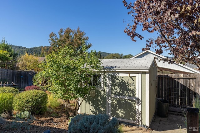 view of home's exterior with a storage shed