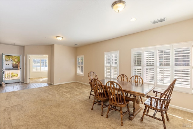 dining room with light carpet