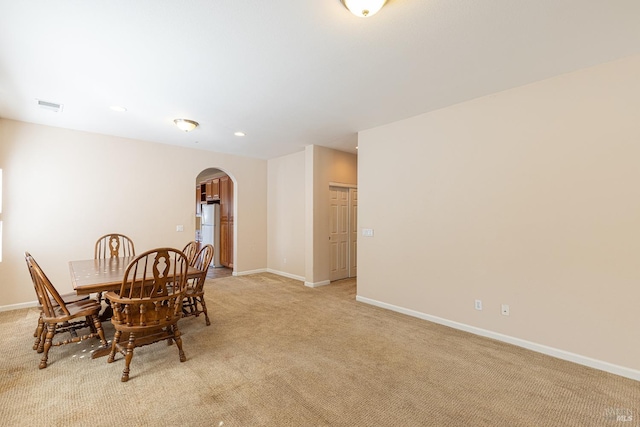 view of carpeted dining space