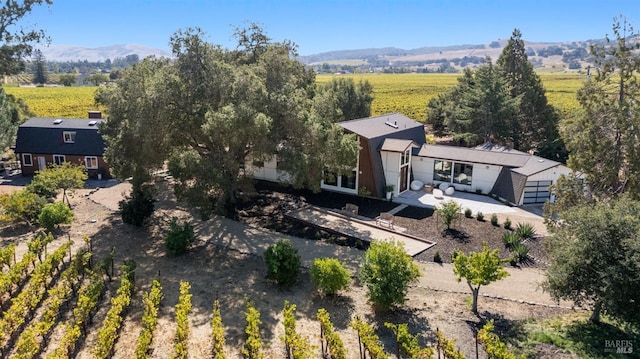 birds eye view of property with a mountain view