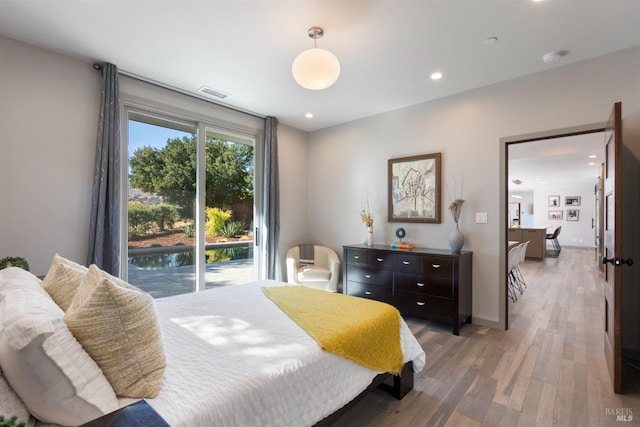 bedroom featuring light wood finished floors, baseboards, visible vents, access to exterior, and recessed lighting