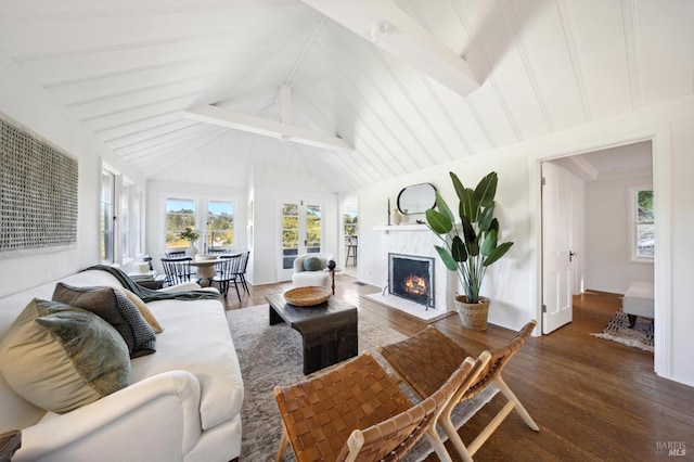 living room featuring a fireplace with flush hearth, beam ceiling, dark wood finished floors, and high vaulted ceiling