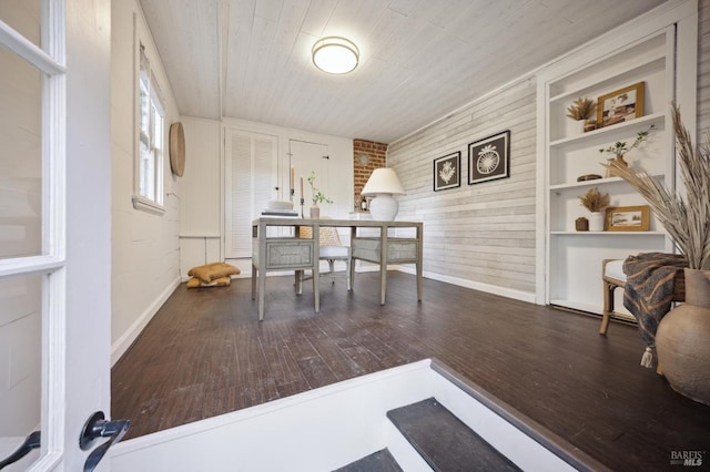 home office featuring wooden ceiling, baseboards, and dark wood-style flooring