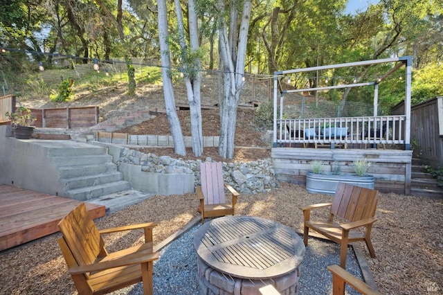 view of patio / terrace with stairs, fence, and a wooden deck