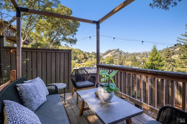 wooden terrace featuring a mountain view