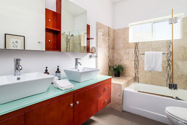 full bathroom with toilet, vanity, shower / bath combination with glass door, and tile patterned flooring