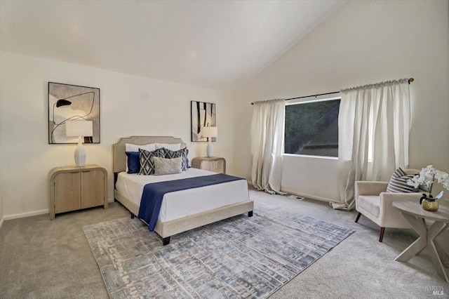 carpeted bedroom with lofted ceiling