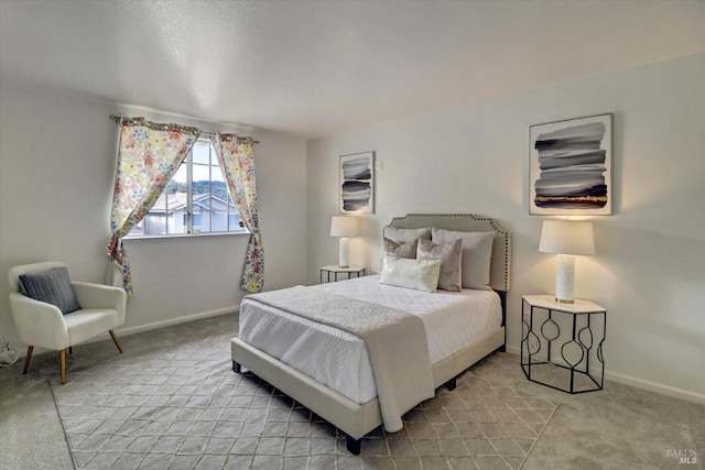 bedroom featuring light carpet