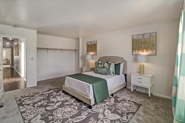 bedroom featuring a closet and dark carpet