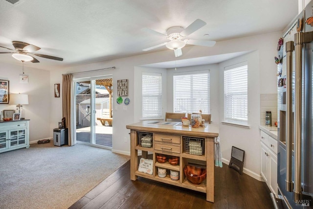 dining room featuring dark wood-type flooring and ceiling fan