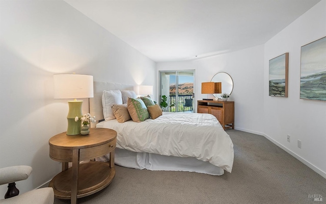 bedroom featuring access to outside and carpet flooring