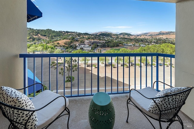 balcony featuring a mountain view