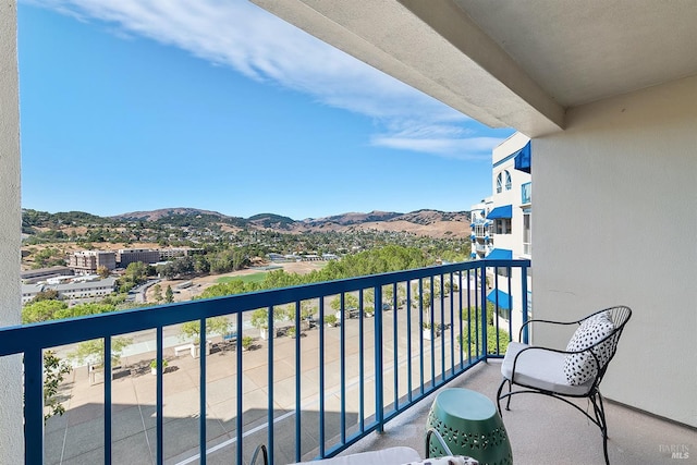 balcony featuring a mountain view