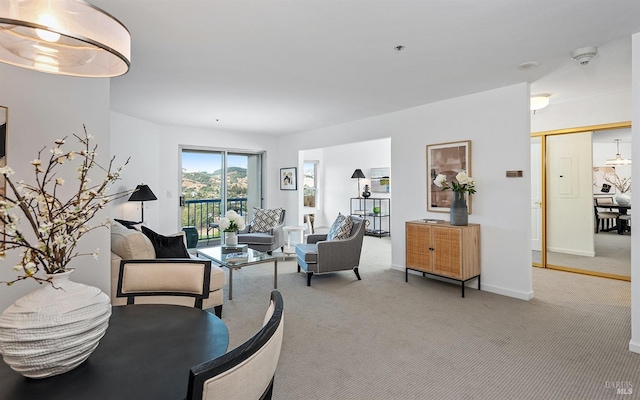 living room featuring light carpet