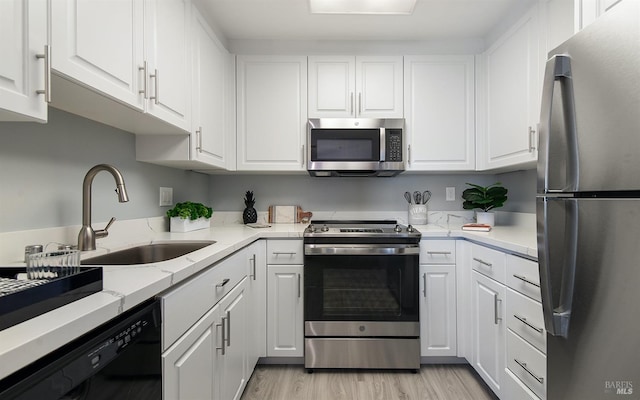 kitchen featuring white cabinetry and stainless steel appliances