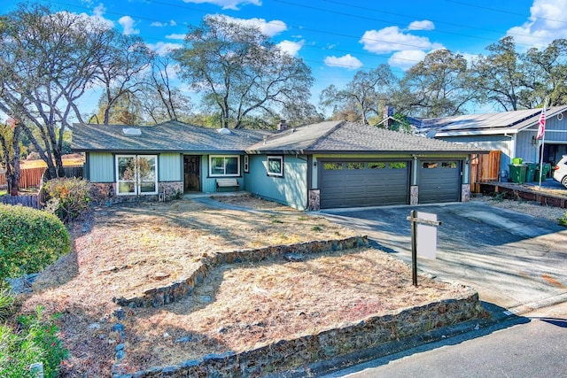 single story home with a garage