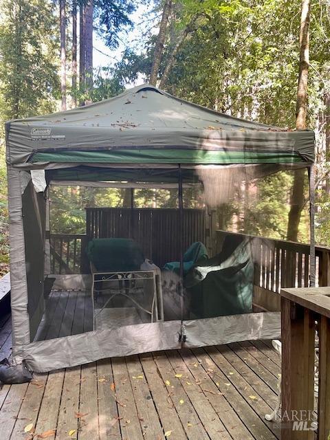 wooden deck featuring a gazebo