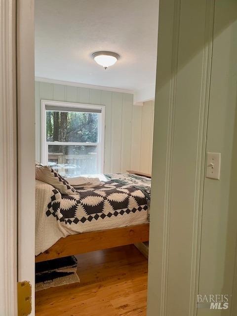 bedroom with light wood-type flooring