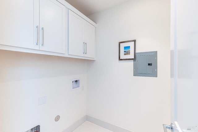 washroom featuring cabinets, hookup for a washing machine, electric panel, and light tile patterned flooring