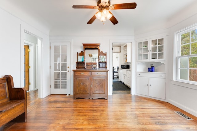 interior space featuring light hardwood / wood-style floors and ceiling fan