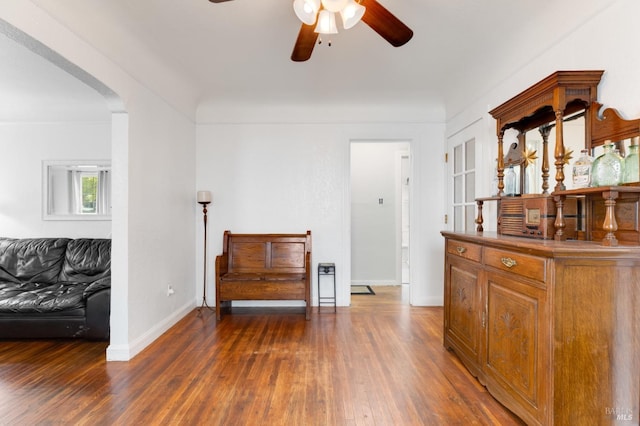 interior space featuring ceiling fan and dark hardwood / wood-style flooring