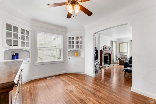 dining room with wood-type flooring and ceiling fan