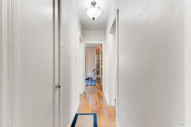 hallway featuring light wood-type flooring