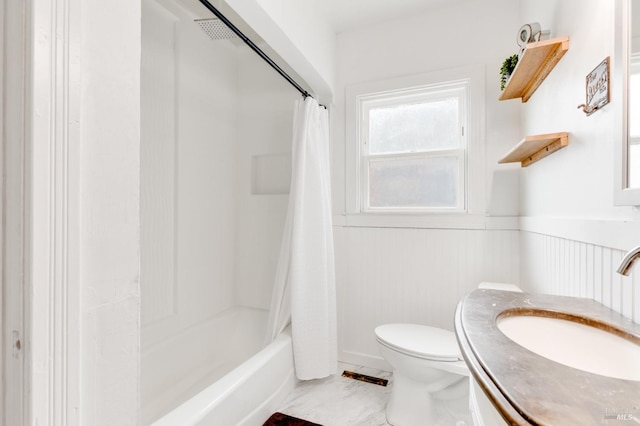 full bathroom with shower / tub combo, vanity, and toilet