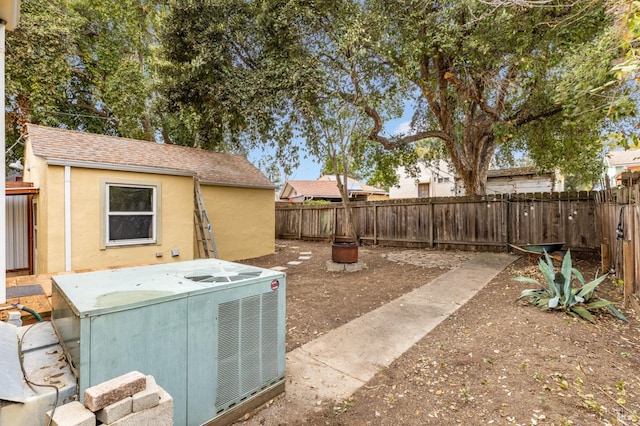 view of yard with central AC unit