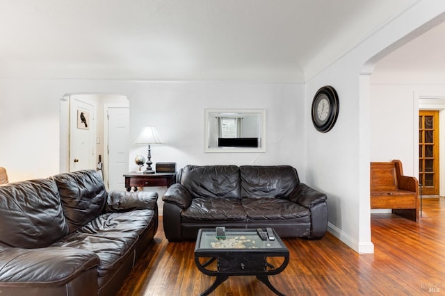 living room featuring dark hardwood / wood-style flooring